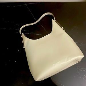 Faux leather Calvin Klein bag. Lovely for summer. Used once .